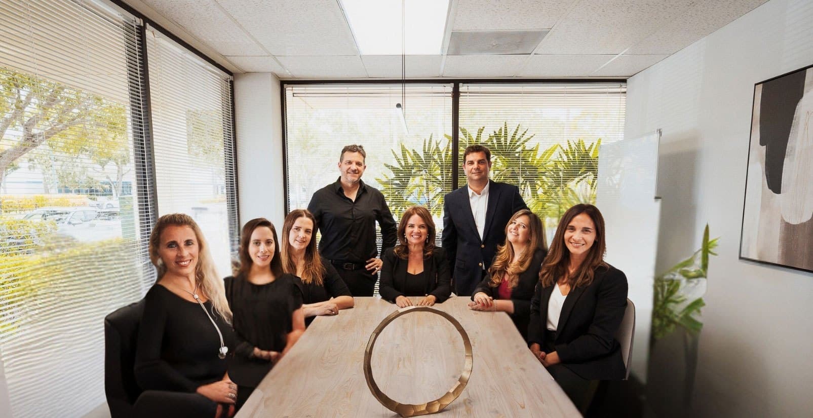 The Interbloom Group team gathered around the conference table